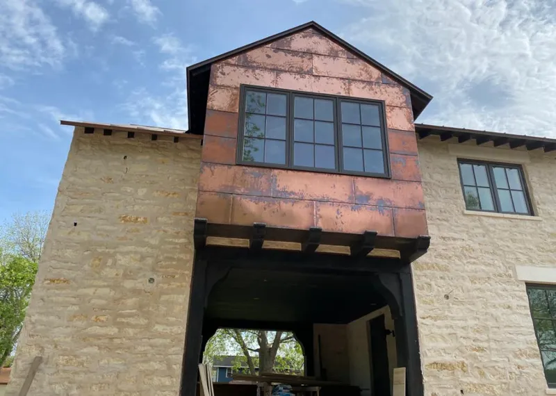 Copper metal panel facade on a stone building for Metal Roof Coating in Manhattan Beach