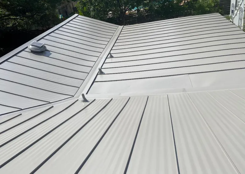Solar attic fan installed on a metal roof for Roof Ventilation in Manhattan Beach